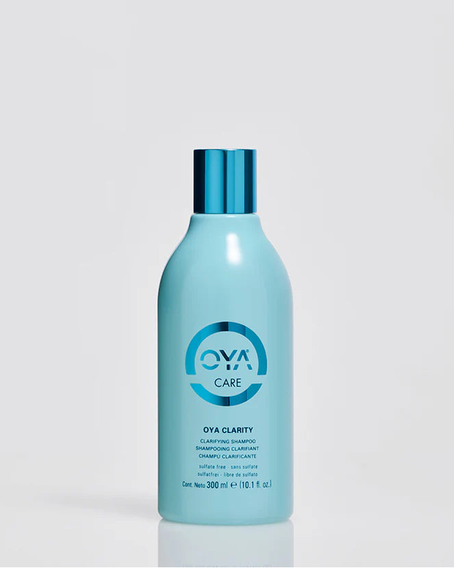 OVA Clarity shampoo bottle on a light gray background