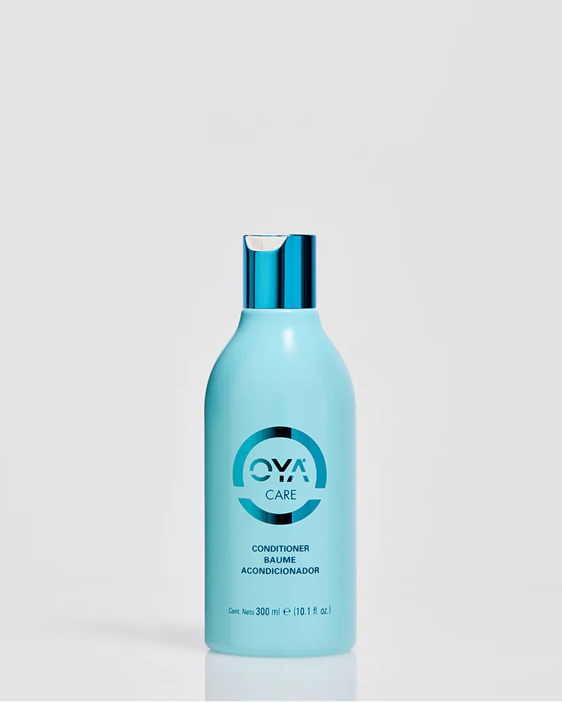 Blue bottle of Oya Care conditioner on a light gray background